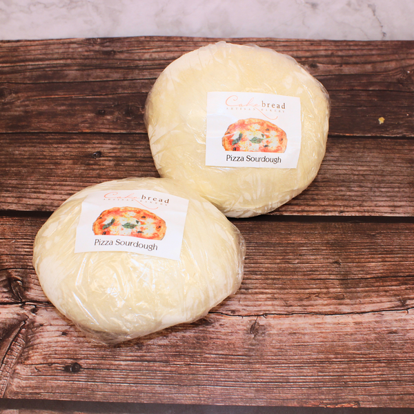 2 balls of artisan sourdough pizza dough, bagged with a logo that reads 'Cakrebread Pizza Sourdough'.