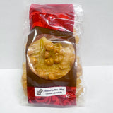 A red and brown bag with a label reading peanut brittle 180g and a warning 'contains peanuts'. Golden artisan peanut brittle can be seen through the clear section of bag.