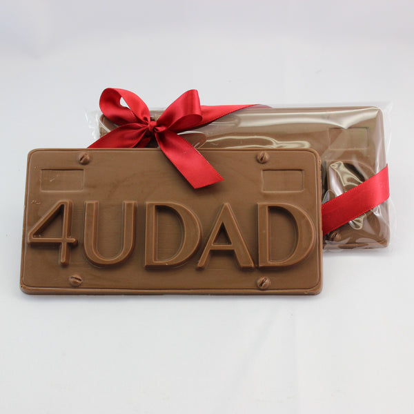 A solid license plate shaped chocolate Father's Day gift bar, with 4 U Dad embossed on the front. 