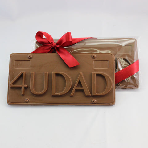 A solid license plate shaped chocolate Father's Day gift bar, with 4 U Dad embossed on the front. 