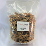 An image showing a clear bag full of granola with the label reading Cakebread and 'House Granola 1.13kg' on the front. 