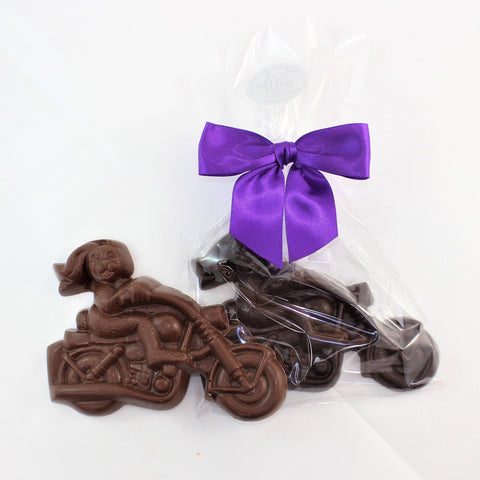 A solid chocolate motorcycle bunny named Dennis Hopper, shown in milk and dark chocolate on a white background.