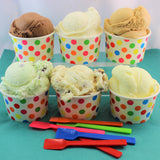 An image of 6 polka dotted cups filled with a variety of Comox Valley Artisan Gelato.
