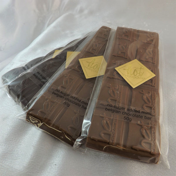 Three wrapped no sugar added chocolate mint bars wrapped in clear, with a Hot Chocolates logo sticker.