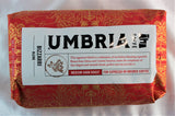 A bright red bag of artisan Italian roast coffee beans labeled Blizzarri, for Espresso and drip use from Caffe Umbria.
