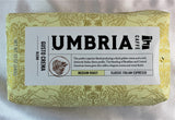 A cream coloured bag of coffee beans labeled classic Italian Espresso, medium roast from Caffe Umbria.