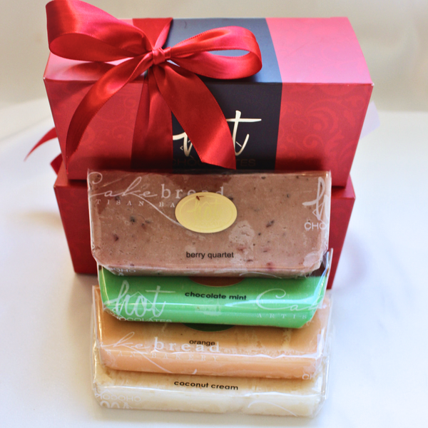 A gift boxed 1lb of assorted artisan fudge with four visible flavors: berry quartet, chocolate mint, coconut cream, and orange.