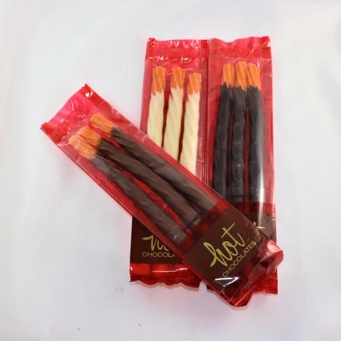 3 packages of chocolate dipped creamsicle licorice, an orange licorice with a creamy centre dipped most of the way in Colombian chocolate. 