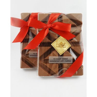 2 solid No Sugar Added Milk Chocolate Bars, wrapped in clear packaging, with a red bow and a gold Hot Chocolates logo.