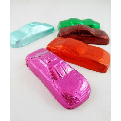 A collection of no sugar added chocolate race cars in various foil colors such as blue, red, green, pink, and brown.