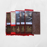 A selection of Vancouver Island Single Origin chocolate bars, displayed in a row with visible chocolate textures and branding.